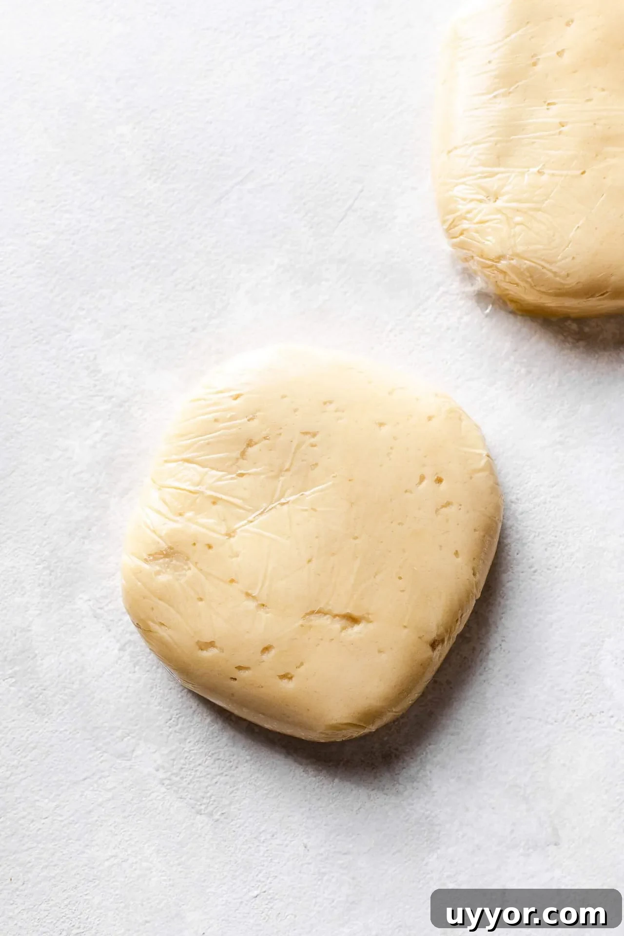 Cinnamon Roll Cookie Recipe: Soft Swirls with Cream Cheese Glaze 5 cinnamon roll cookie dough divided into 2 disks and wrapped in plastic wrap