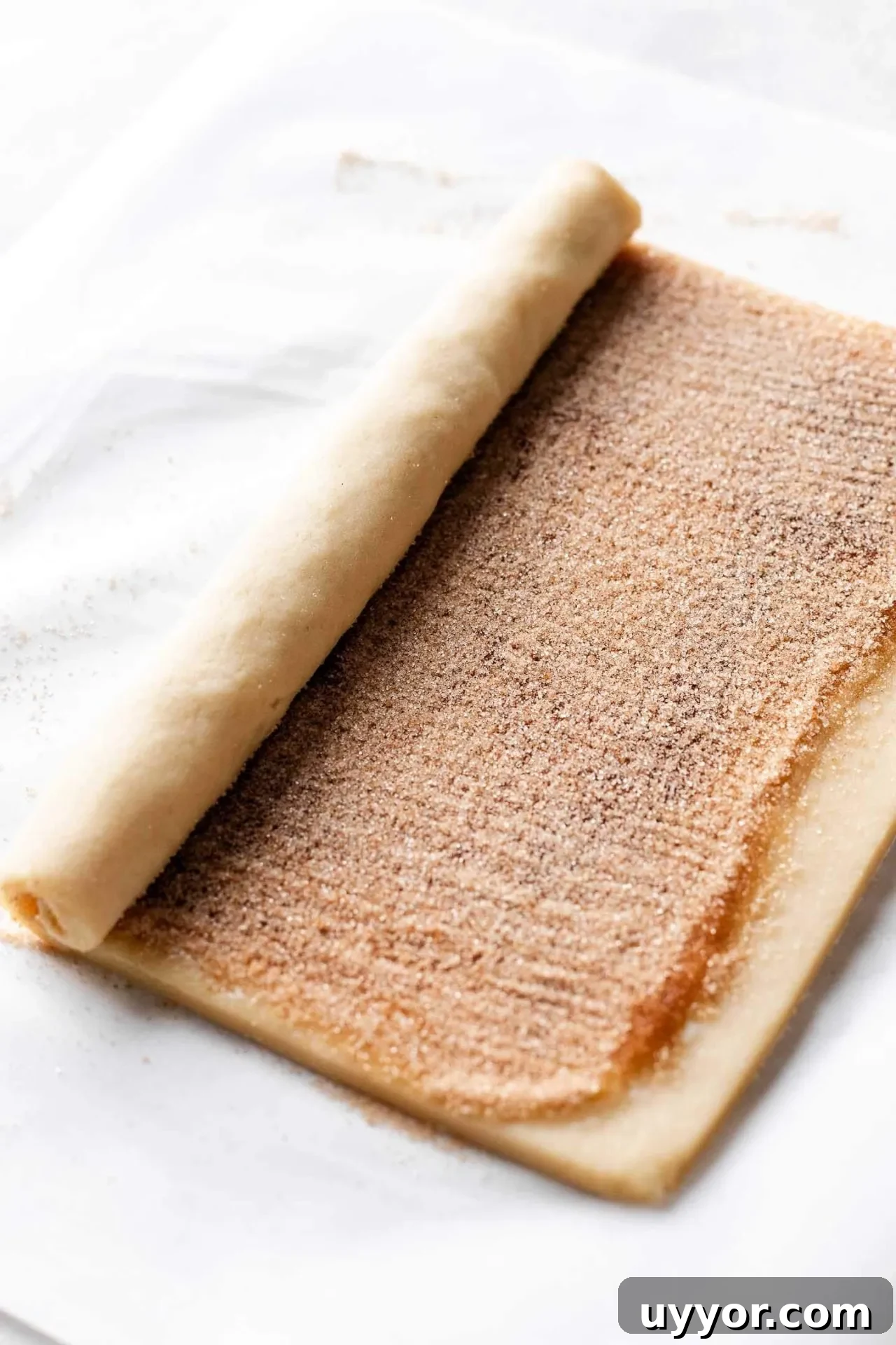 Cinnamon Roll Cookie Recipe: Soft Swirls with Cream Cheese Glaze 7 cinnamon roll cookie dough filled with butter and cinnamon sugar and partially rolled into a log