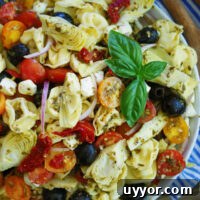 light and easy pesto pasta salad with cheese tortellini and artichokes