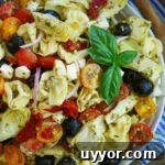 light and easy pesto pasta salad with cheese tortellini and artichokes