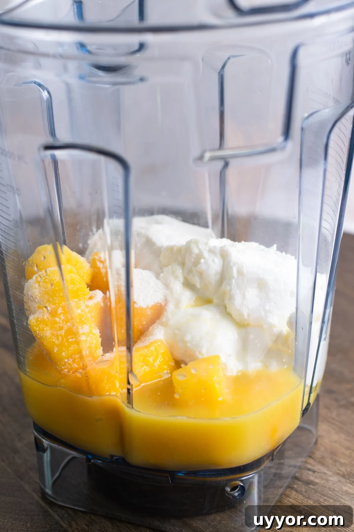 Blender pitcher with the ingredients for the recipe