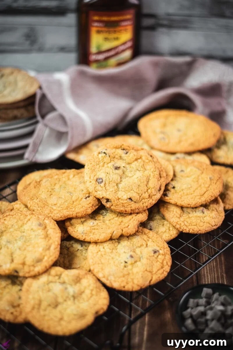 Rum-Infused Chocolate Chip Cookies: Chewy & Boozy Recipe 10 Delicious rum chocolate chip cookies placed on a cooling rack.