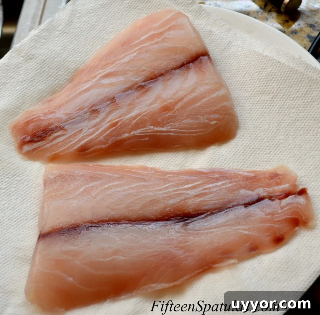 SearedSnapperMangoAvocado Snapper Filets on a Paper Towel to Soak up Excess Moisture