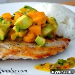 Seared Snapper with Mango Avocado Salsa Recipe 2 Seared Snapper - On a Plate with Mango Avocado Salsa on top and Rice in Background