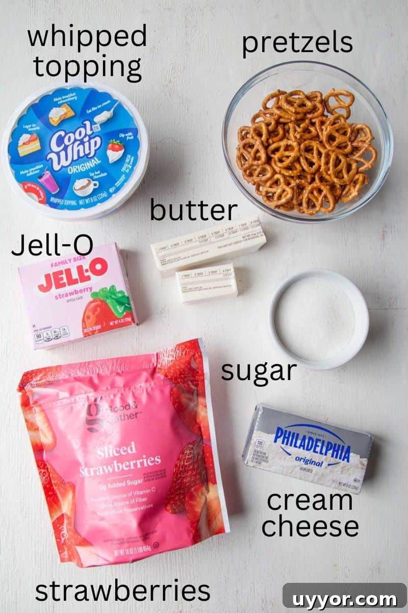 Strawberry Pretzel Salad Recipe with Creamy Cheesecake Layer 4 strawberry gelatin, strawberries, pretzels, and other ingredients.