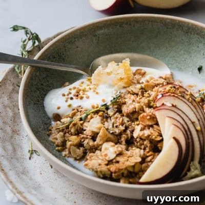 Warm Granola Breakfast Bowl is the perfect cozy start to any morning. Healthy oats, sweet, natural maple syrup and toasted almonds and coconut. These are the winter equivalent of a warm hug on a cold day.