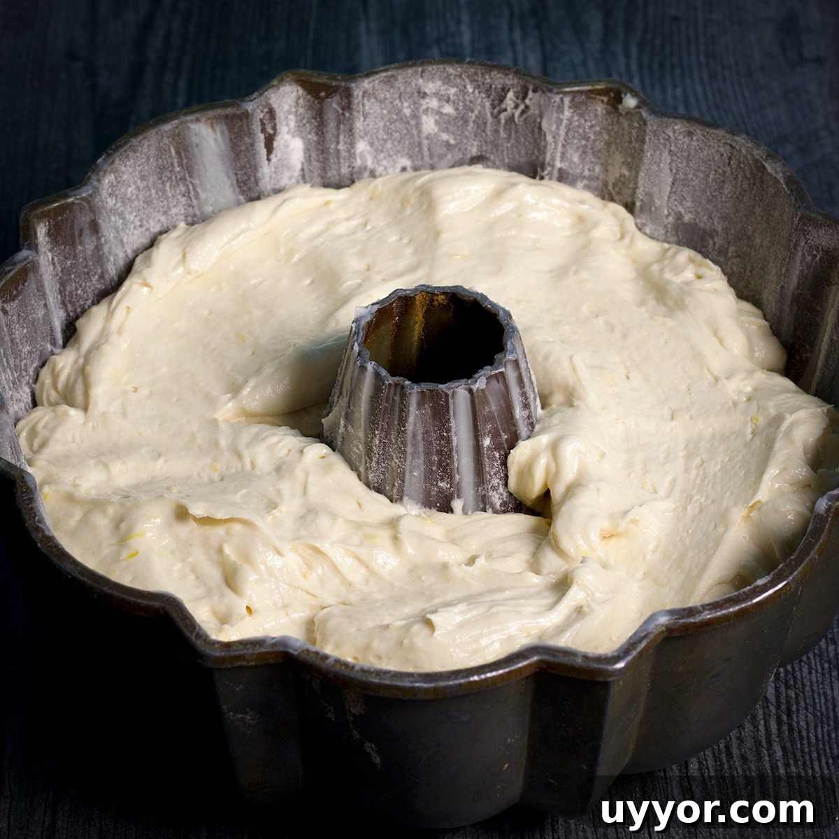 Lemon Bundt Cake with Zesty Tart Lemon Glaze 11 Lemon cake batter spread into a bundt pan and ready to bake.