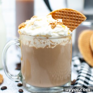 Copycat Crème Brûlée Latte Recipe Like Starbucks 6 Several stroopwaffles are placed next to a full glass mug of creme brûlée latte.