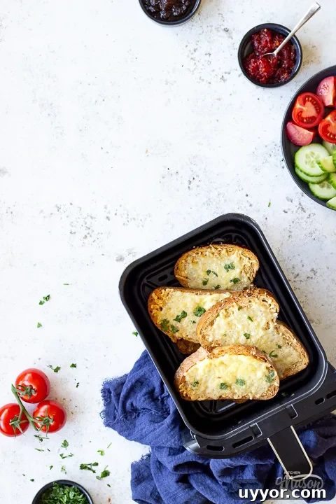Air Fryer Cooking Times UK: Quick Guide by Food Type 7 Air fried cheese on toast in a drawer with other ingredients on plates around it