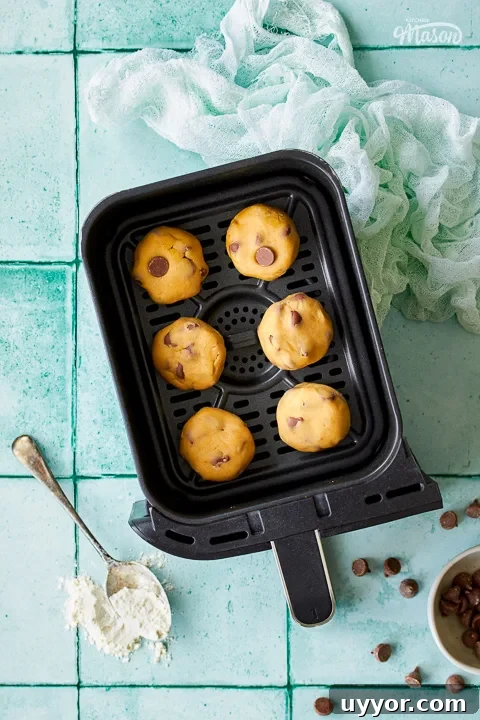 Air Fryer Cooking Times UK: Quick Guide by Food Type 3 Cookie dough balls in an air fryer drawer