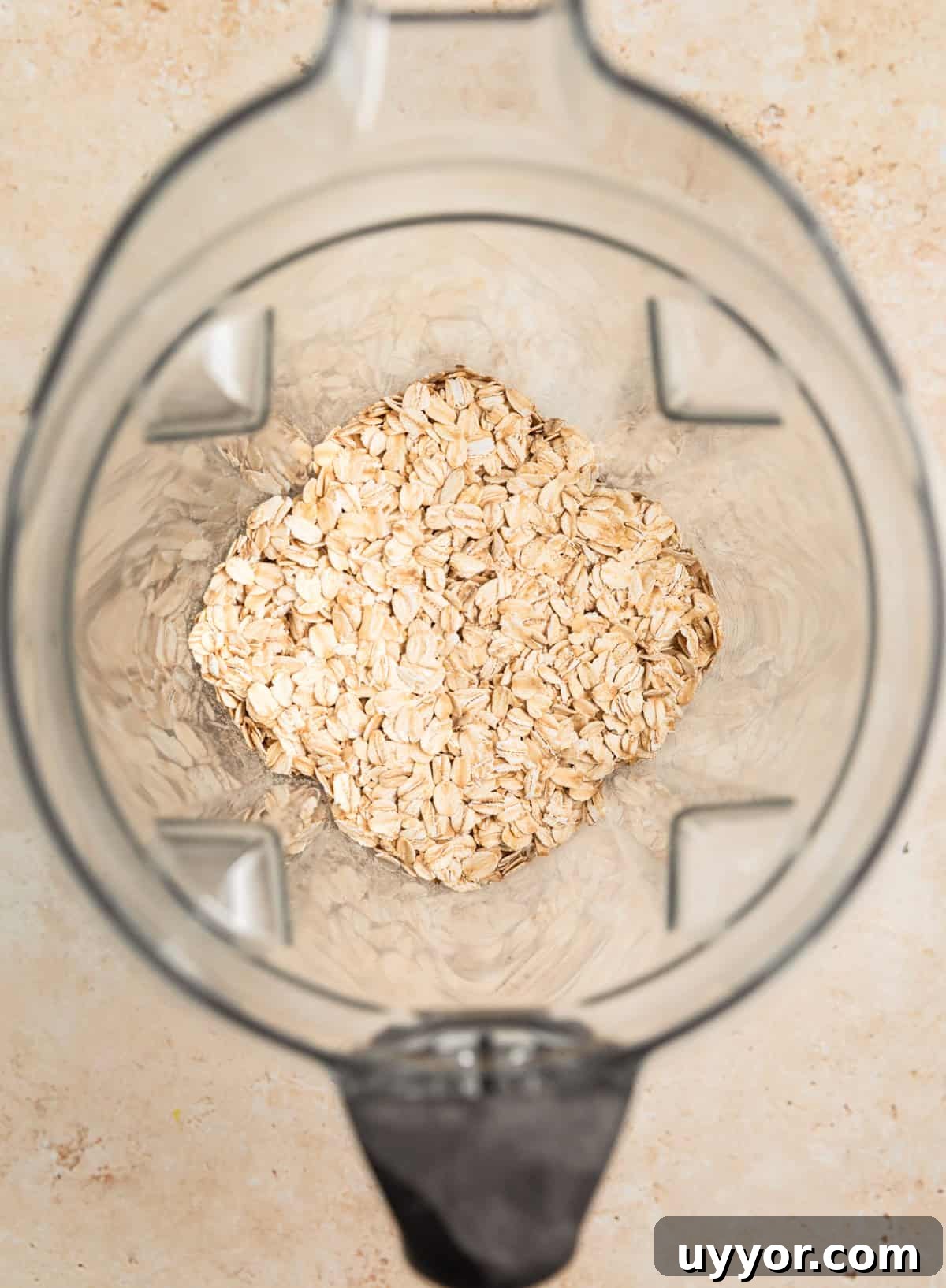 Rolled oats in blender before being processed into oat flour.