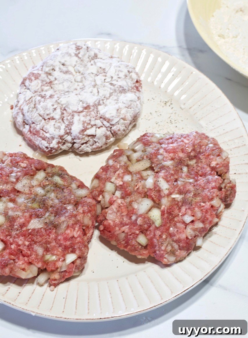Savory Hamburger Steaks with Rich Onion Gravy Recipe 14 Hamburger steaks plated.