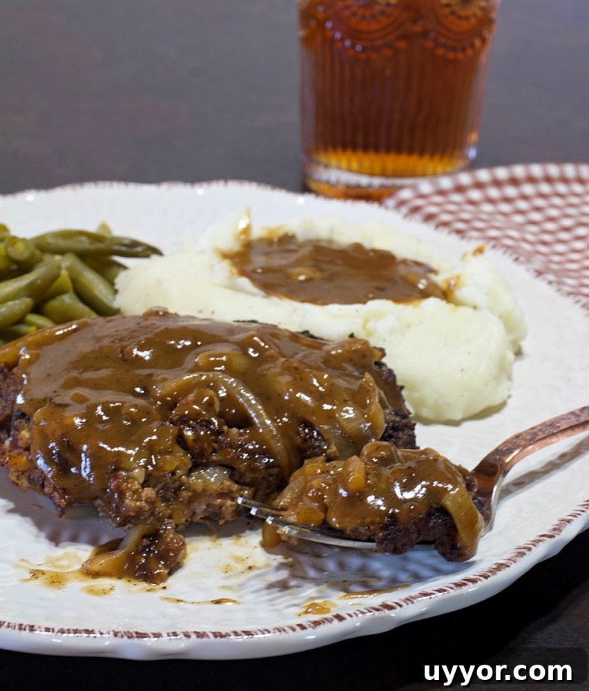 Savory Hamburger Steaks with Rich Onion Gravy Recipe 5 Close-up of hamburger steaks.