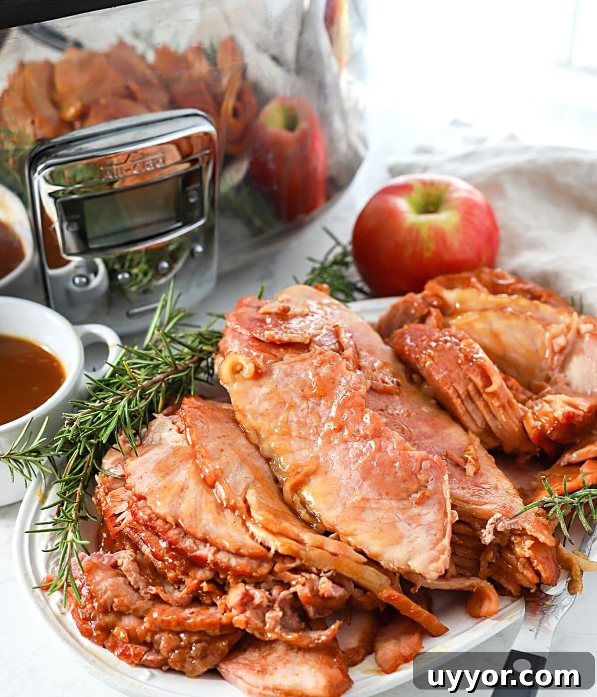 Slow-Cooker Ham Recipe: Tender, Juicy Crock Pot Ham Tutorial 9 sliced spiral ham on a plate