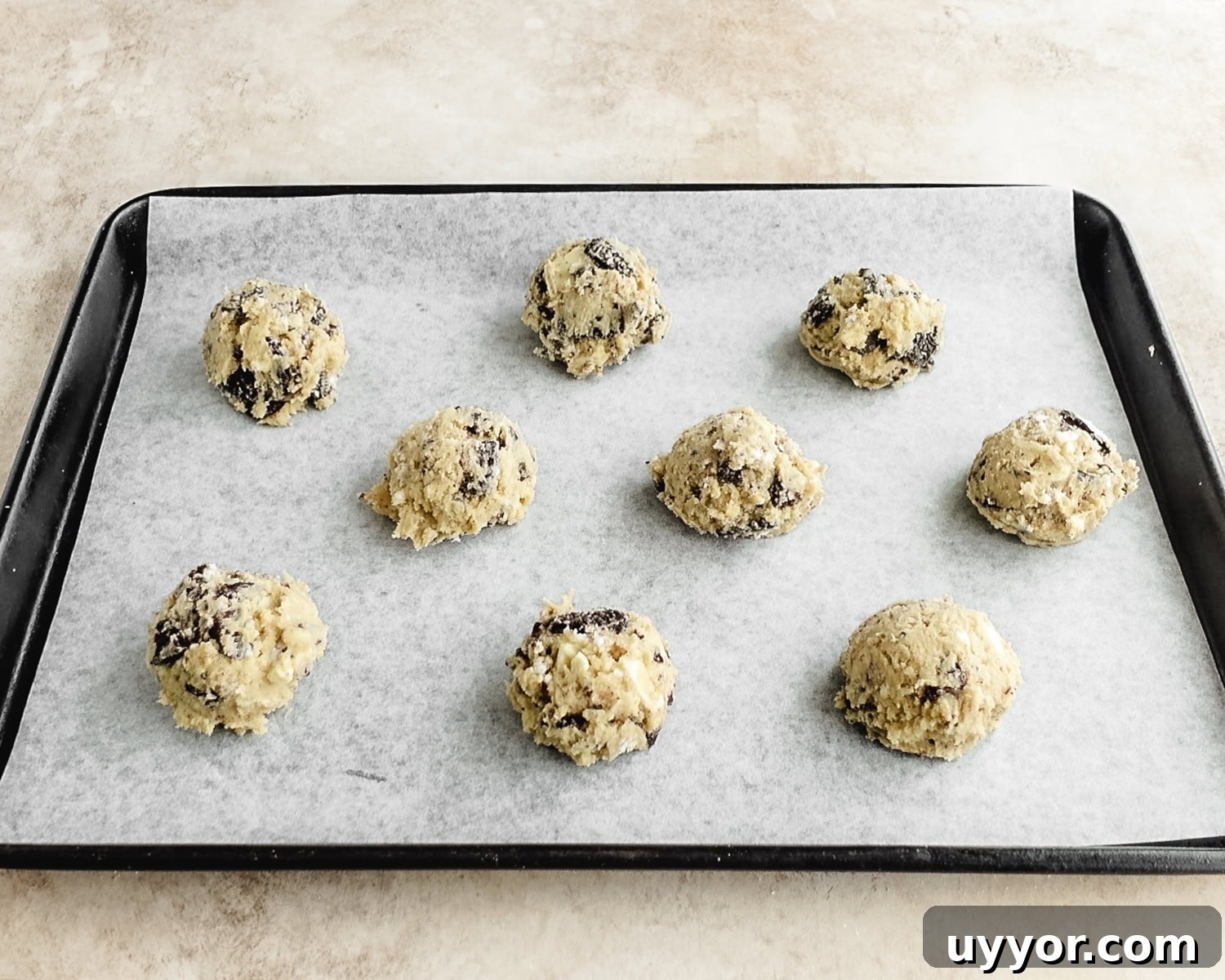 Place cookie dough balls on prepared baking sheet.