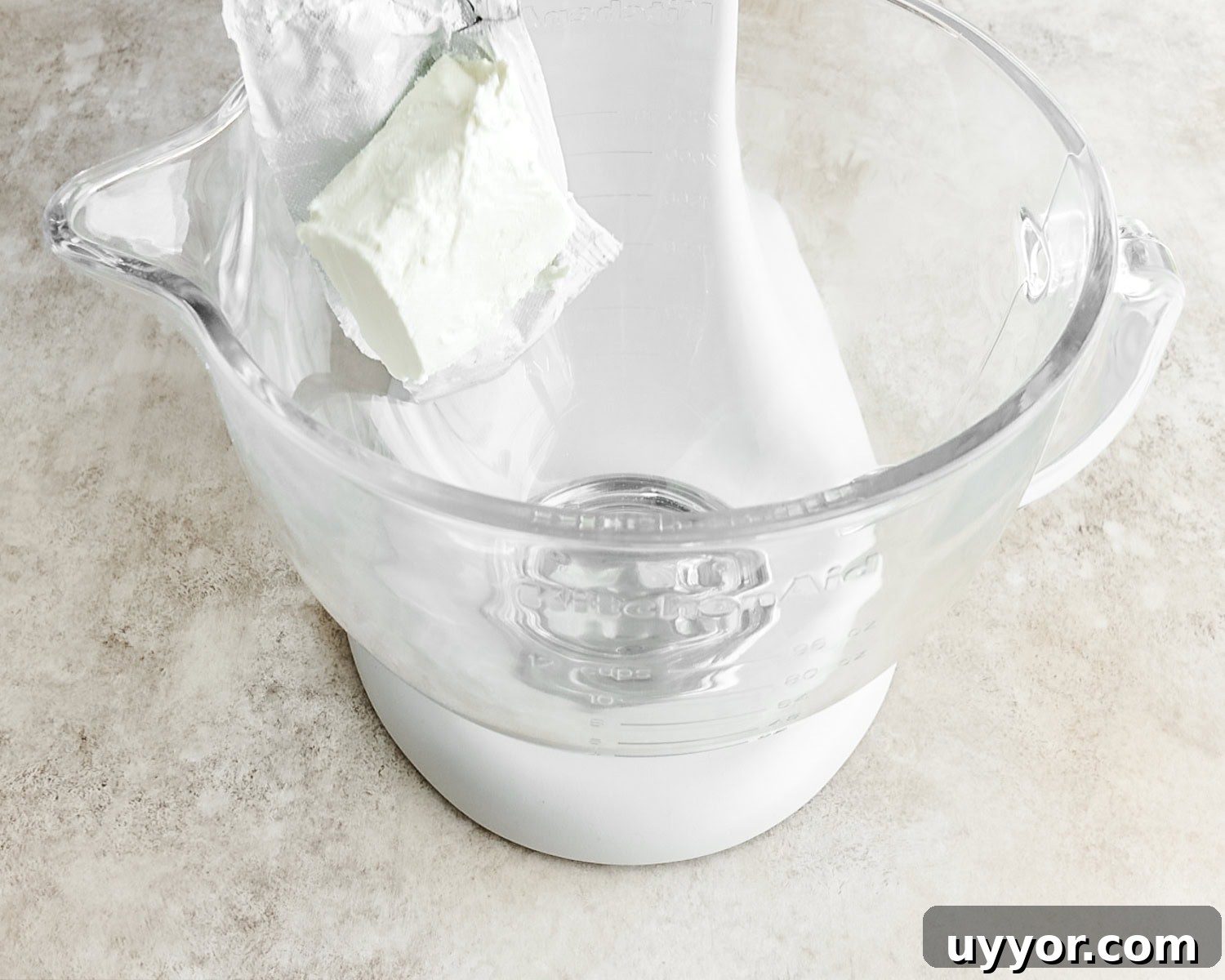 Add the softened cream cheese to the bowl of a stand mixer.