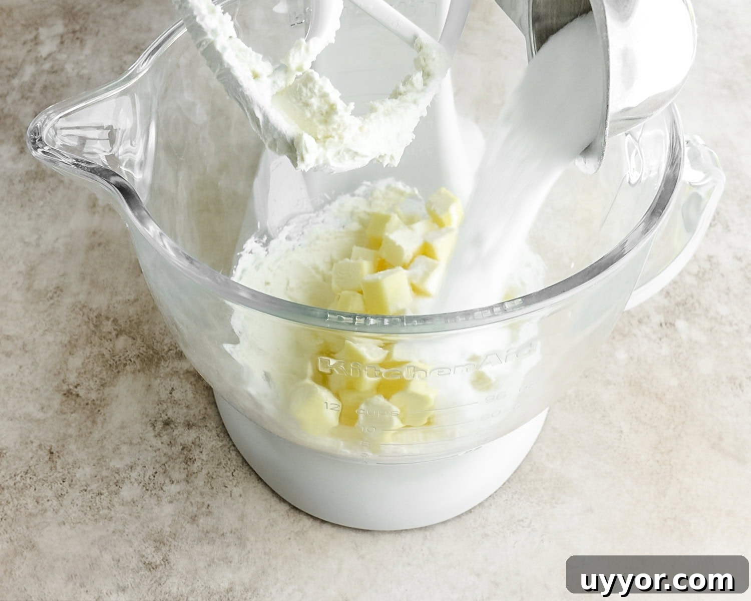Add granulated sugar to the butter and cream cheese.
