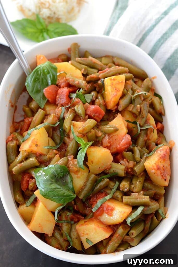 83-Recipe Meal Plan: Weekly Menus for Every Diet 5 Overhead view of a white serving dish with green beans and potatoes.