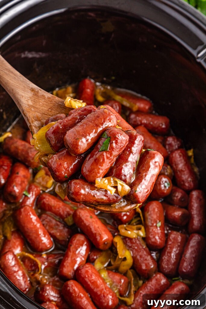 Crockpot Mississippi Little Smokies Recipe: Savory Slow-Cooker Sausages 2 wooden spoon with slow cooker Mississippi little smokies