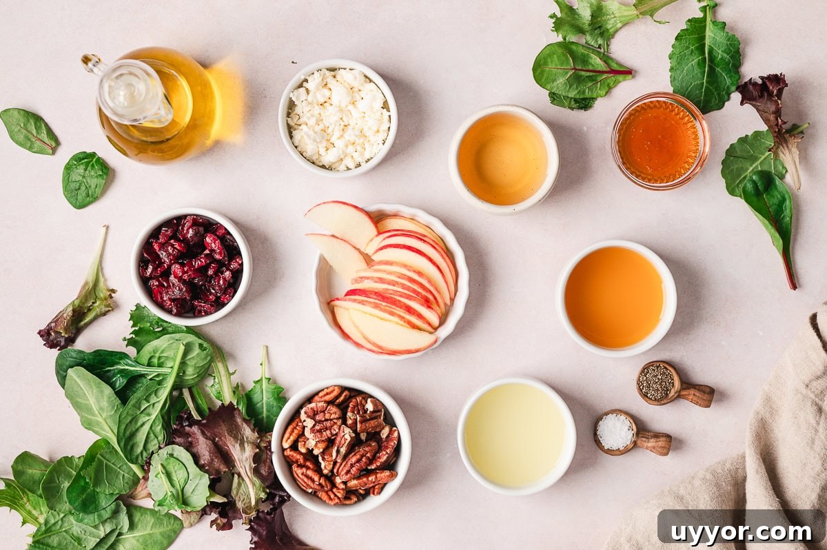 an overhead view of the ingredients need to make apple pecan salad