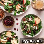 bowls of salad with mixed greens and apples and pecans