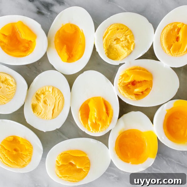 Hard boiled and soft boiled eggs on a counter