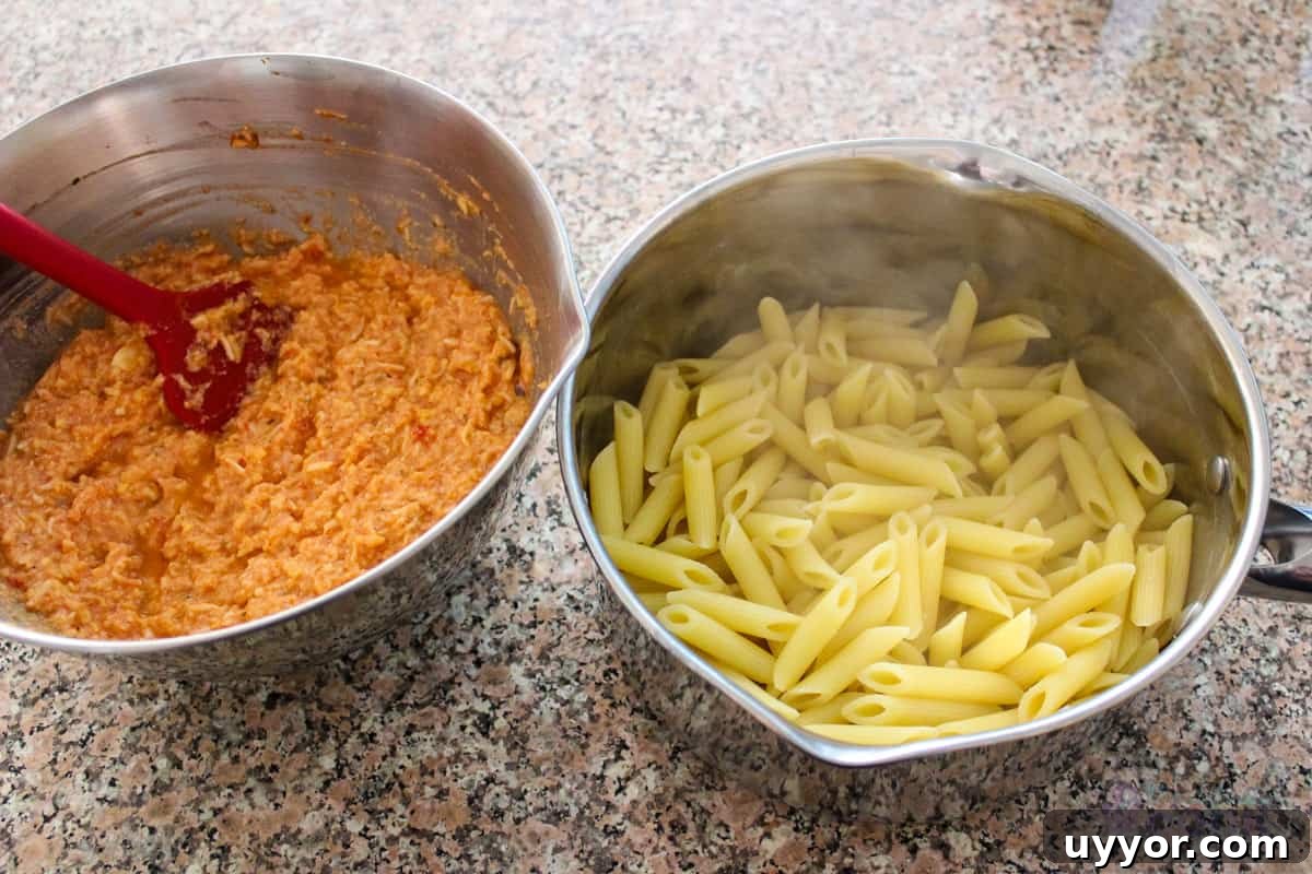 Cheesecake Factory Four-Cheese Pasta Copycat Recipe 6 Sauce in one bowl and piping hot pasta ready to mix in