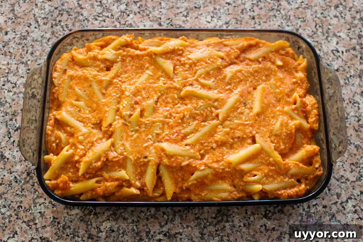 Cheesecake Factory Four-Cheese Pasta Copycat Recipe 7 Four Cheese Pasta in baking dish ready to go in oven
