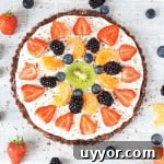 A super easy no bake Fruit Pizza that's gluten and grain free. A fantastic healthy dessert that the whole family can enjoy this summer!