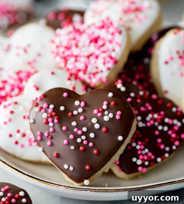 Heart shaped cookies with icing and sprinkles