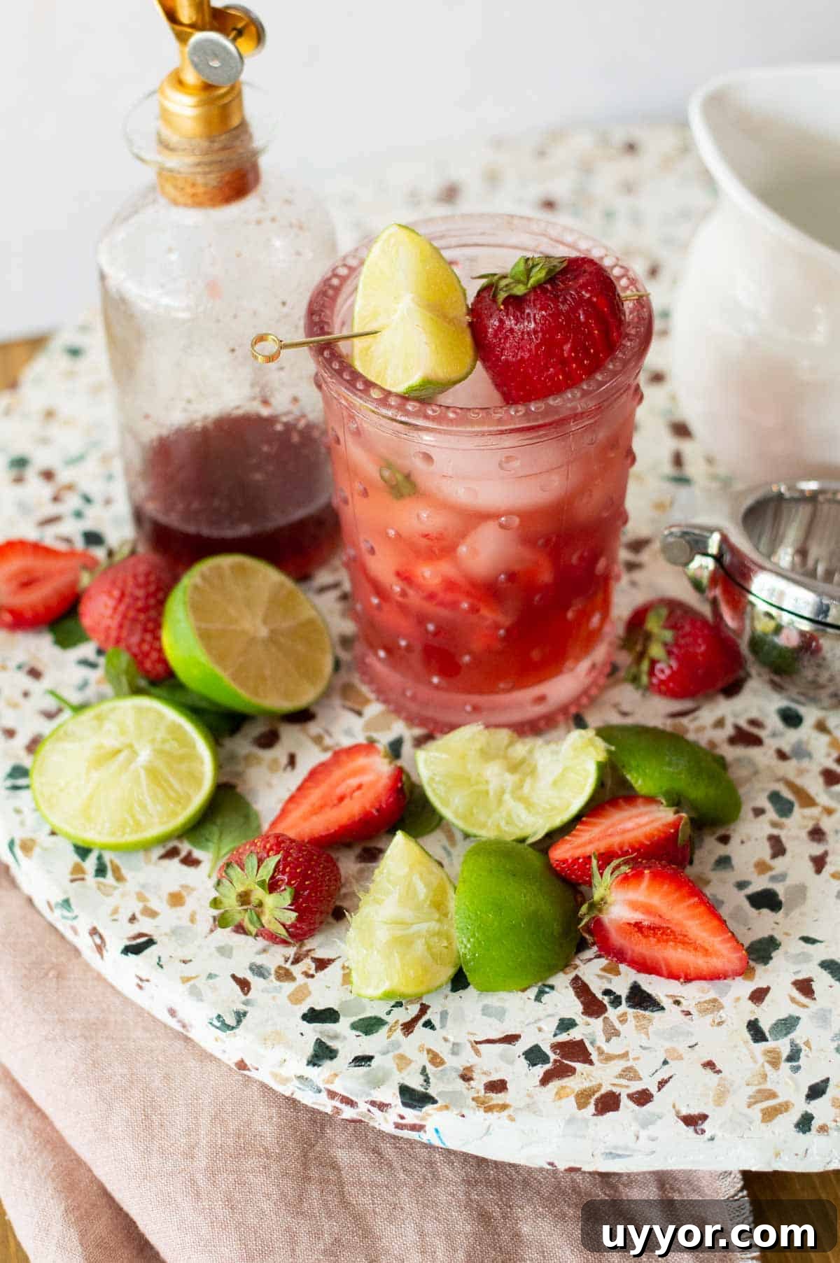 Strawberry Mojito Mocktail Recipe: Refreshing Non-Alcoholic Cocktail 6 Strawberry Mojito Mocktail with limes and strawberries on a plate