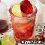 Strawberry Mojito Mocktail Recipe: Refreshing Non-Alcoholic Cocktail 7 Strawberry Mojito Mocktail in a pink glass