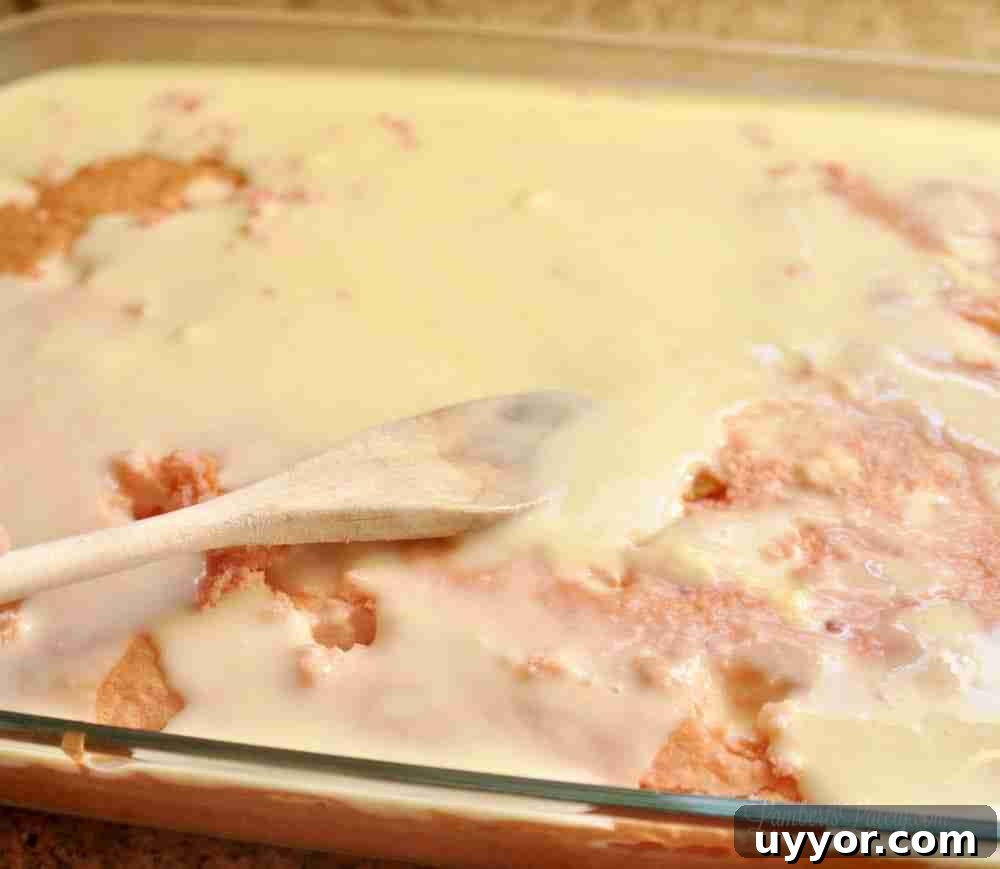 Strawberry Banana Pudding Cake Recipe — Moist Layer Cake 7 spreading pudding mix over cake.