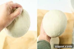 hand shaping dough into smooth ball.