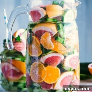 Infused Spa Water Recipes for Refreshing Hydration 2 Spa water is in a pitcher; a glass of spa water just behind it.