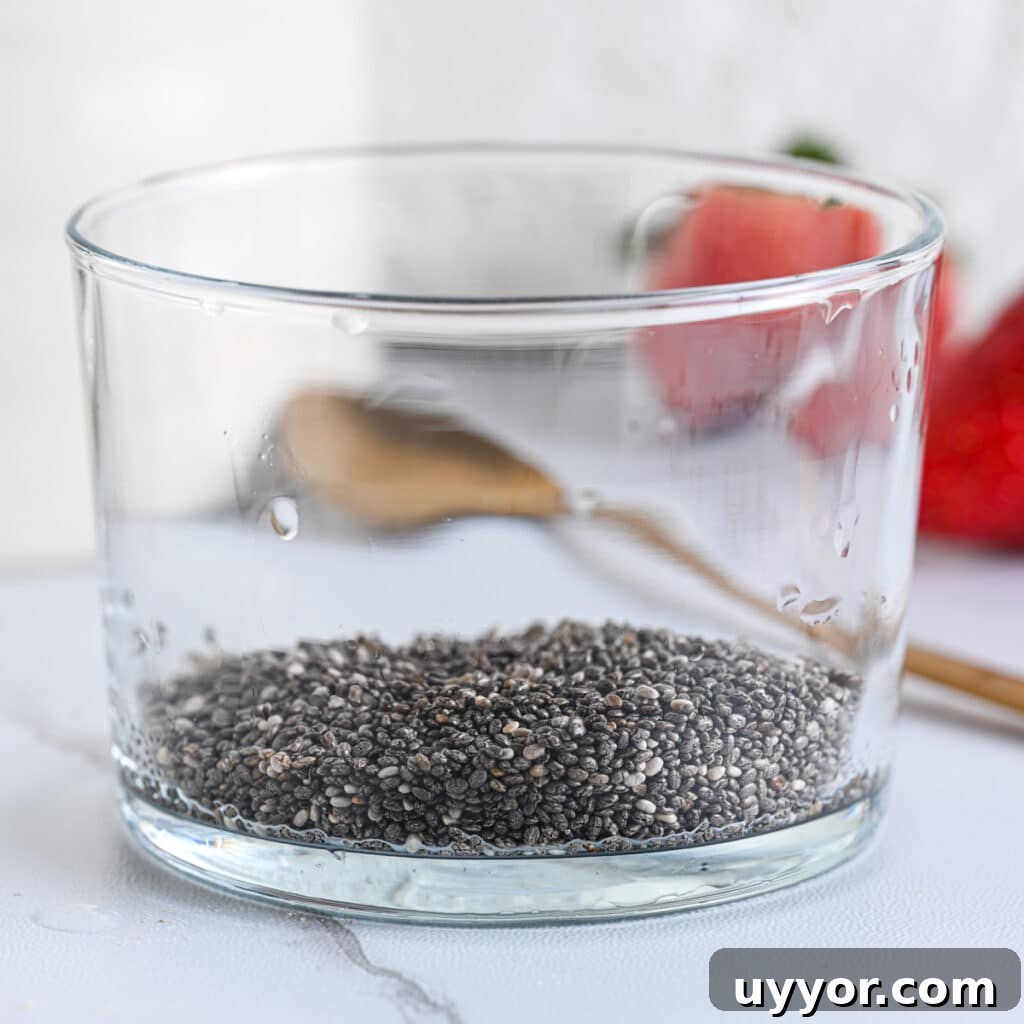 Creamy Chia Seed Pudding Recipes for Breakfast & Desserts 4 Chia seeds in a glass cup as first ingredients for the pudding