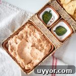 Creamy Refried Bean Dip with Canned Beans — Crowd-Pleasing Recipe 6 Refried bean dip in an appetizer tray with chips.