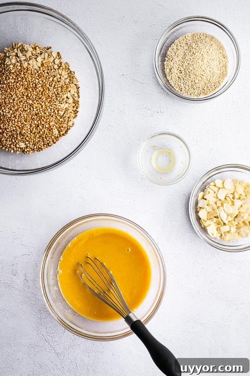 Tahini Sesame Granola with Honey & Orange 4 A top down view of the ingredients for tahini granola with orange and honey.
