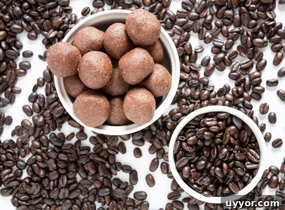 Keto Chocolate Coffee Fat Bombs — Caffeinated Low‑Carb Treats 7 keto chocolate fat bombs in a bowl surrounded by coffee beans on countertop