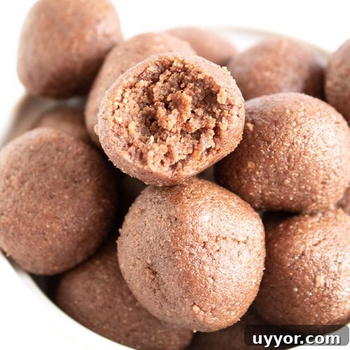 Keto Chocolate Coffee Fat Bombs — Caffeinated Low‑Carb Treats 9 closeup of keto chocolate fat bombs in a bowl with piece missing from one