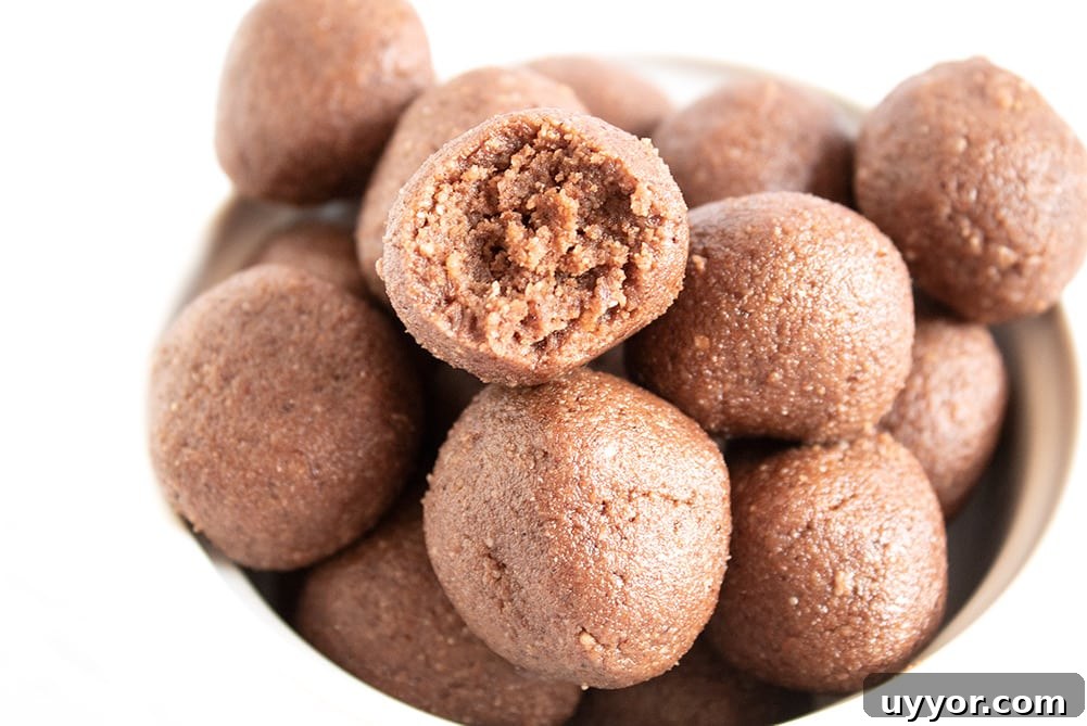 Keto Chocolate Coffee Fat Bombs — Caffeinated Low‑Carb Treats 3 closeup of keto chocolate fat bombs in a bowl with piece missing from one