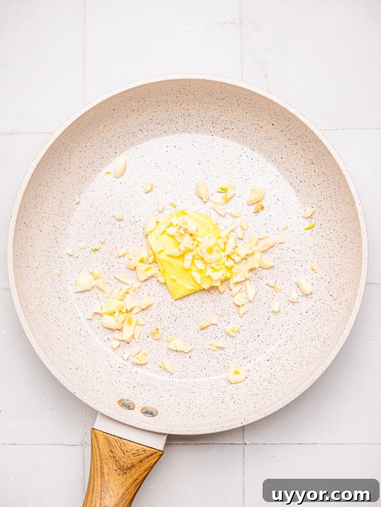 Creamy Garlicky Cauliflower Mash Recipe for Satisfying Comfort 6 Butter and garlic in a pan.