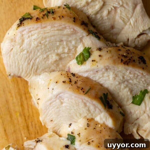 Crispy Honey Mustard Baked Chicken Drumsticks Recipe 17 Slices of keto baked chicken breast seasoned with black pepper and garnished with small amounts of chopped parsley on a wooden surface.