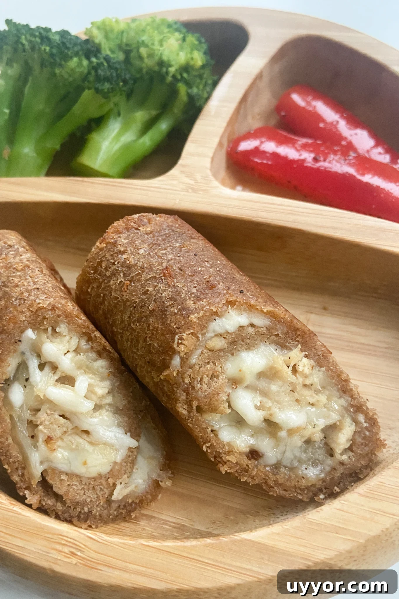 Cheesy Chicken Stuffed Bread Rolls Recipe 5 Cheesy chicken rollups served with broccoli and red bell peppers