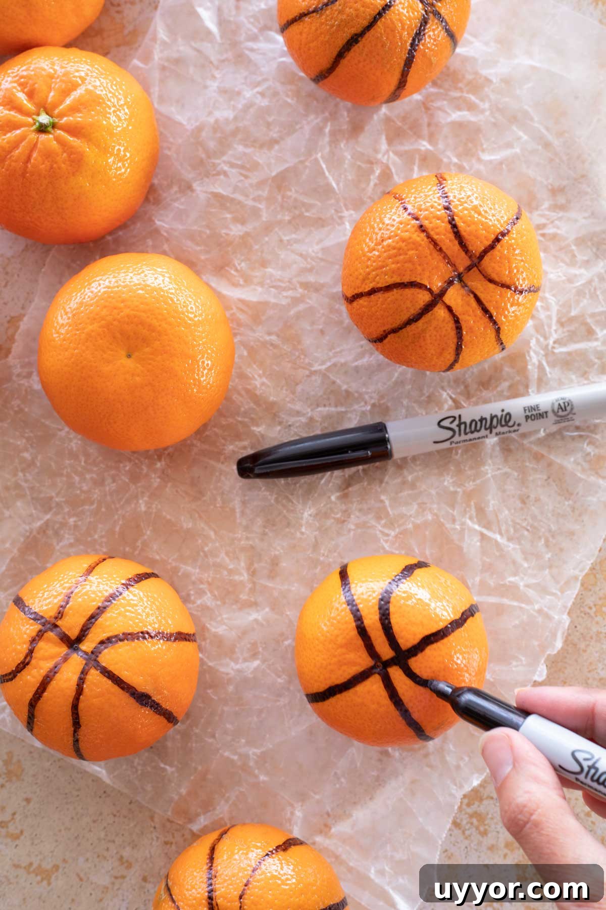 50+ Winning March Madness Game Day Recipes and Snacks 12 Adding additional curved lines to make clementine look like basketball.
