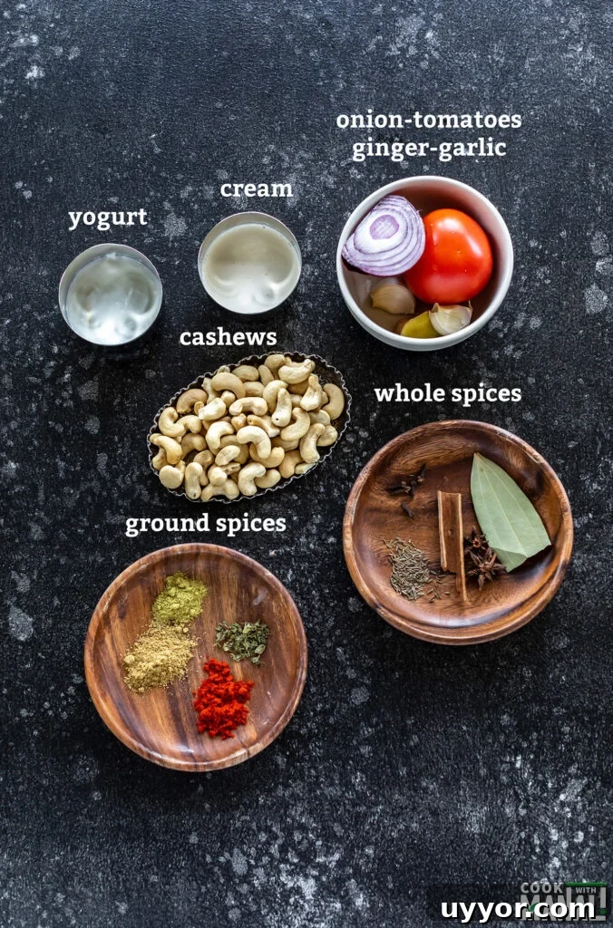 ingredients for making cashew curry arranged on a board