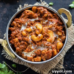cashews with spices served in a copper kadai