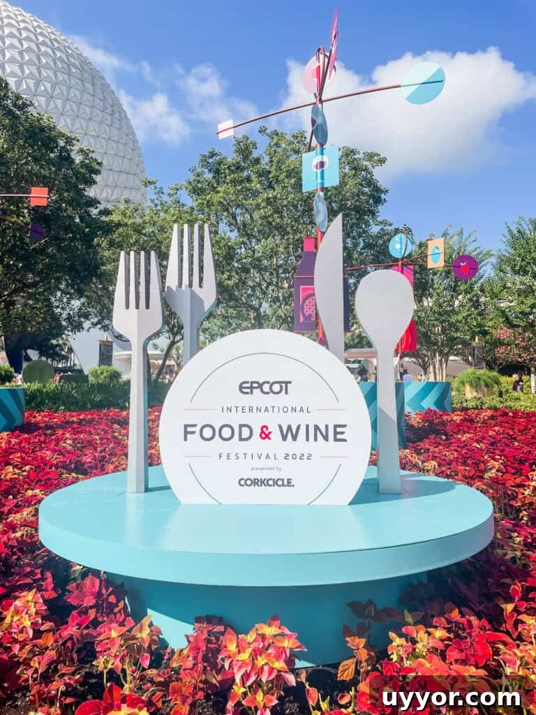 Top Tips for Navigating Epcot Festivals Like a Pro 3 Food and Wine Festival signage in front of Spaceship Earth.