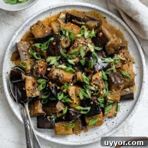 completed Perfect Sautéed Eggplant plated on a plate against a white background