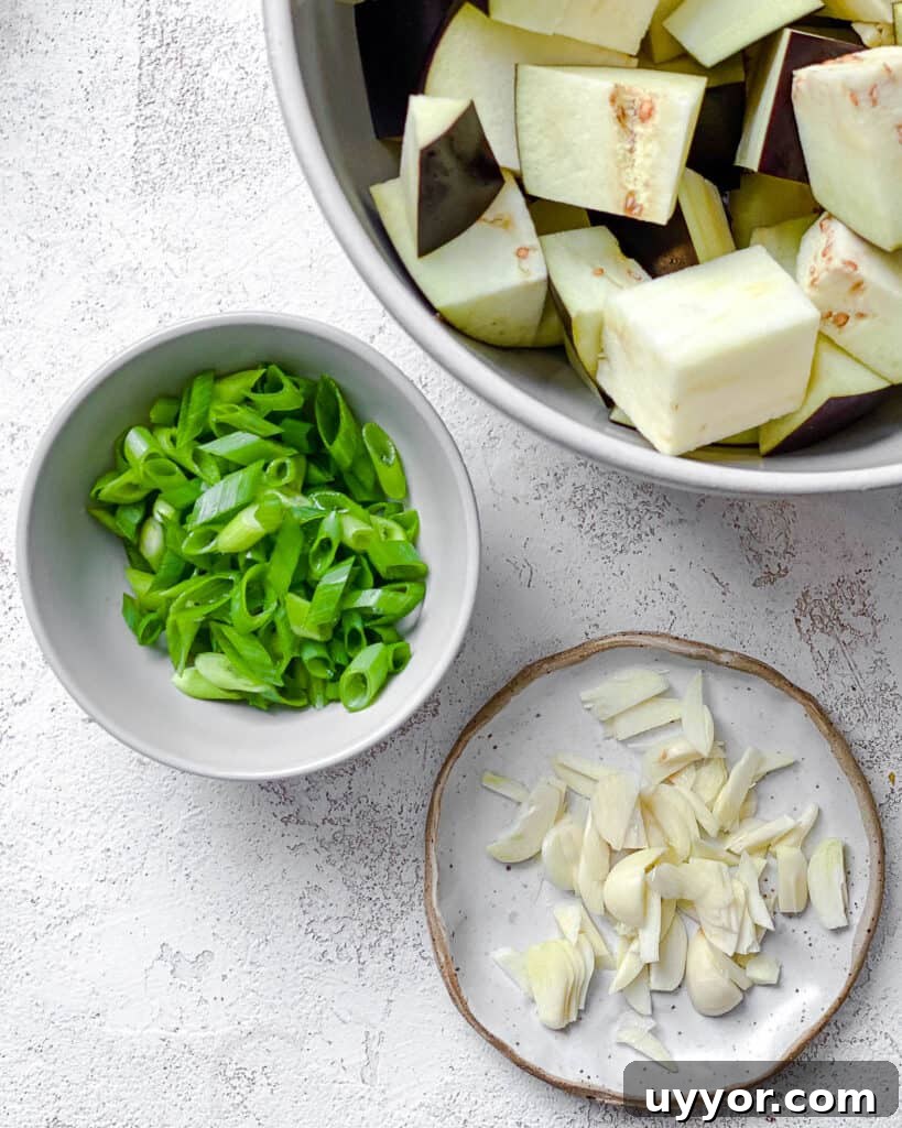 ingredients for Perfect Sautéed Eggplant measured out against a white surface